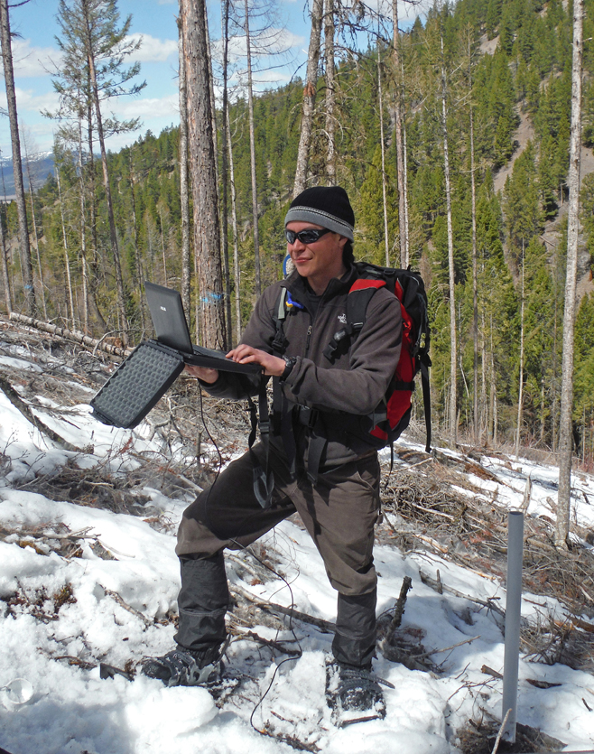 UM hydrology graduate student Casey Ryan conducts fieldwork in the Lubrecht Experimental Forest in April.